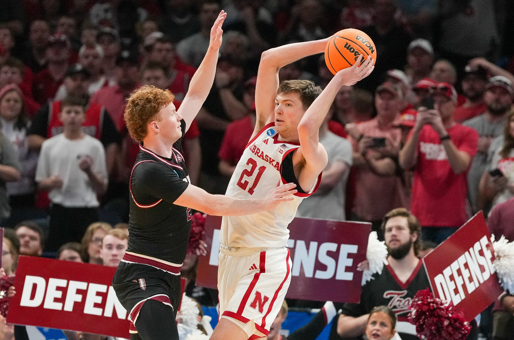 Nebraska forward Pryce Sandfort, right, keeps the ball away from Troy guard Cobi Campbell during the first half in the first round of the NCAA college basketball tournament, Thursday, March 19, 2026, in Oklahoma City. (AP Photo/Kyle Phillips)