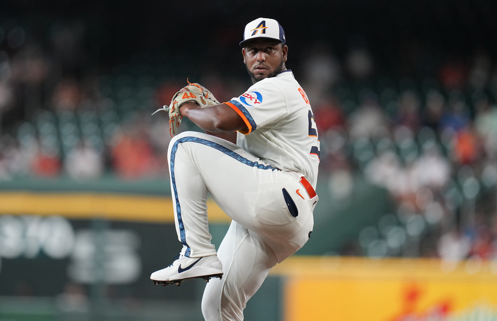 Houston Astros starting pitcher Ronel Blanco winds up to deliver to Miami Marlins' Kyle Stowers during the first inning of a baseball game, Monday, July 20, 2026, in Houston. (AP Photo/Karen Warren)