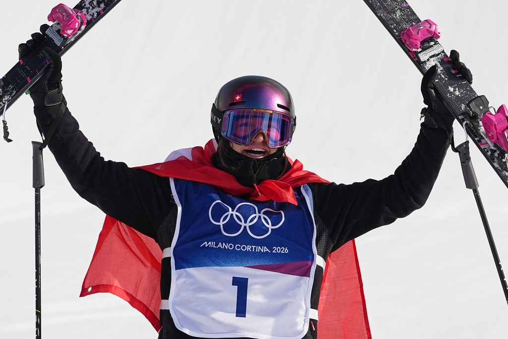Switzerland's Mathilde Gremaud celebrates her gold medal win in the women's freestyle skiing slopestyle finals at the 2026 Winter Olympics, in Livigno, Italy, Monday, Feb. 9, 2026. (AP Photo/Gregory Bull)