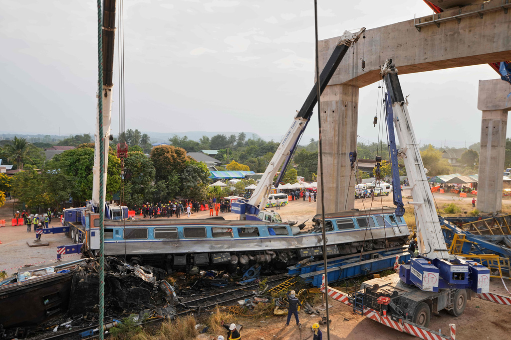 The scene after a construction crane fell into a passenger train in Nakhon Ratchasima province, Thailand, Wednesday, Jan.14, 2026. (AP Photo/Sakchai Lalit))