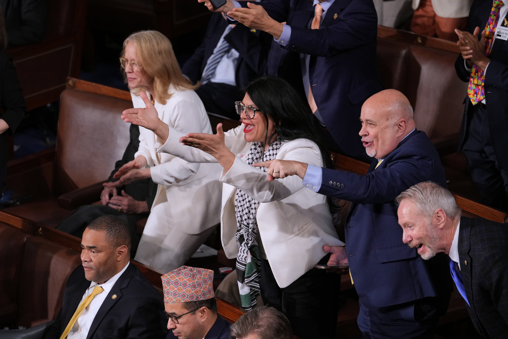 Rep. Rashida Tlaib, D-Mich., and other Democratic members, react as President Donald Trump gives his State of the Union address to a joint session of Congress, at the Capitol in Washington, Tuesday, Feb. 24, 2026. (AP Photo/J. Scott Applewhite)