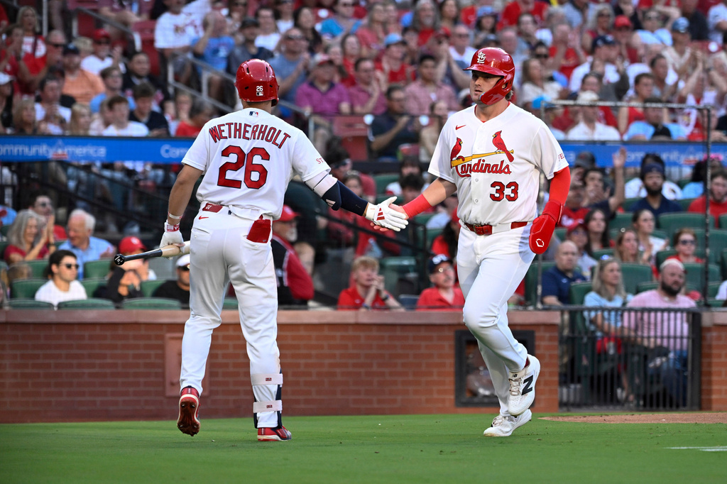 St. Louis Cardinals' Blaze Jordan (33) is congratulated by teammate JJ Wetherholt (26) after scoring a run in the second inning of a baseball game against the San Diego Padres, Tuesday, June 16, 2026, in St. Louis. (AP Photo/Joe Puetz)