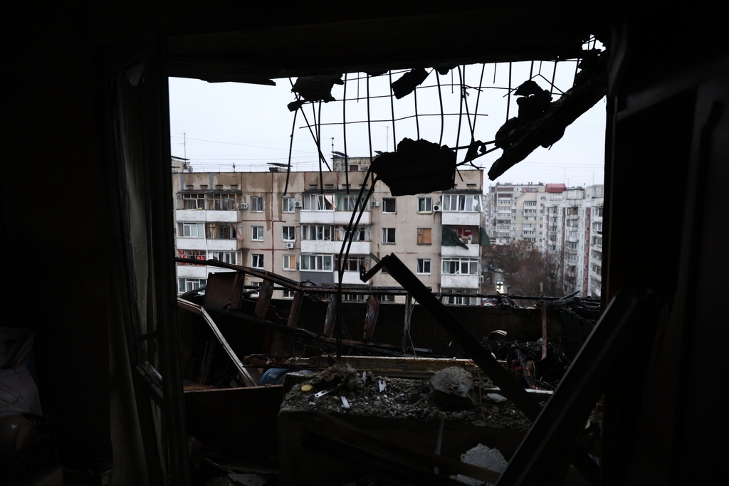 Residential neighbourhood is seen from the broken window of a damaged apartment building hit by a Russian drone in Zaporizhzhia, Ukraine, Thursday, Feb. 26, 2026. (AP Photo/Kateryna Klochko)