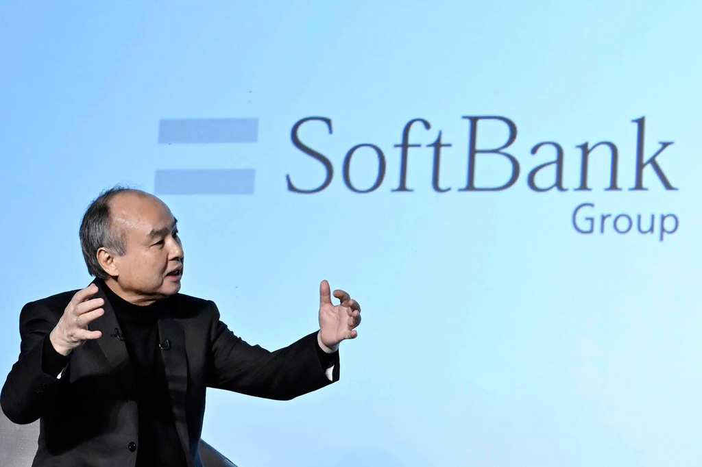 FILE -SoftBank Chief Masayoshi Son talks with OpenAI Chief Sam Altman, not in photo, during an event for enterprises in Tokyo, in Tokyo, Monday, Feb. 3, 2025. (Kyodo News via AP, File)