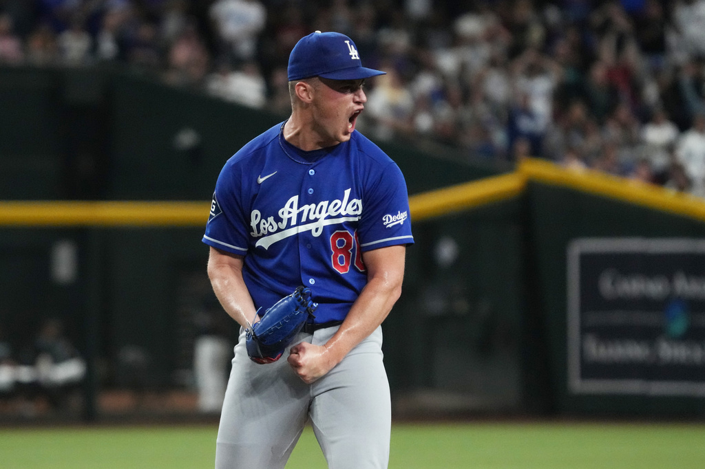 Los Angeles Dodgers catcher Hunter Feduccia reacts after defeating the Arizona Diamondbacks during a baseball game, Saturday, Aug 8, 2026, in Phoenix. (AP Photo/Rick Scuteri)