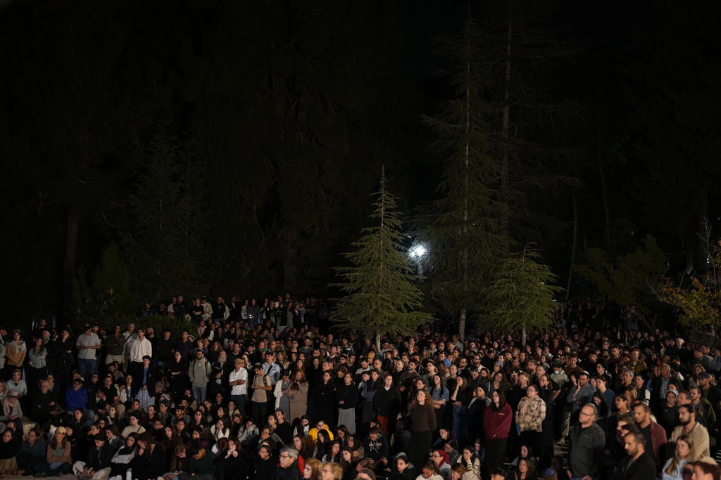 Mourners attend the funeral of slain hostage Captain Daniel Peretz at Mt. Herzl military cemetery in Jerusalem, Wednesday, Oct. 15, 2025. Peretz's body was returned from Gaza to Israel as part of a ceasefire agreement between Israel and Hamas. (AP Photo/Francisco Seco)