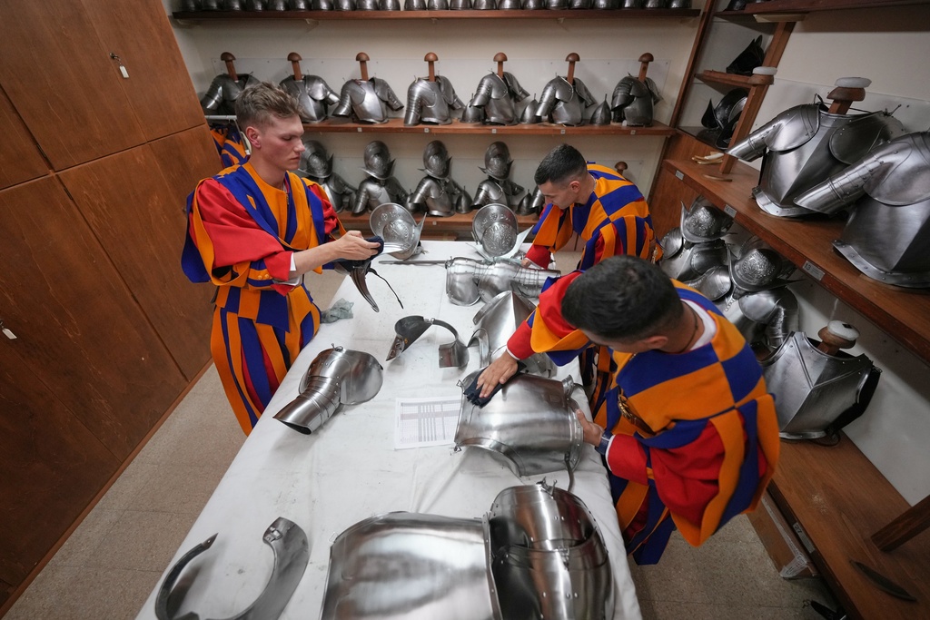 Pontifical Swiss Guards prepare ahead of their swearing in ceremony, at the Vatican, Saturday, Oct. 4, 2025. (AP Photo/Andrew Medichini)