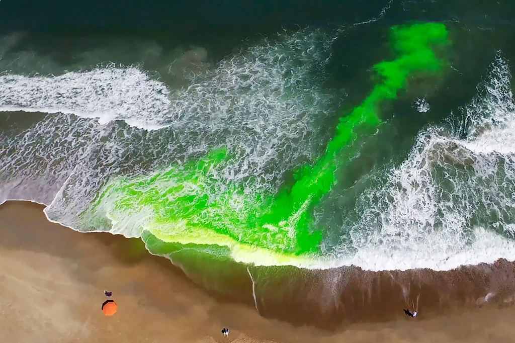 FILE - This image provided by NOAA shows a harmless green dye used to show a rip current. (NOAA via AP, File)
