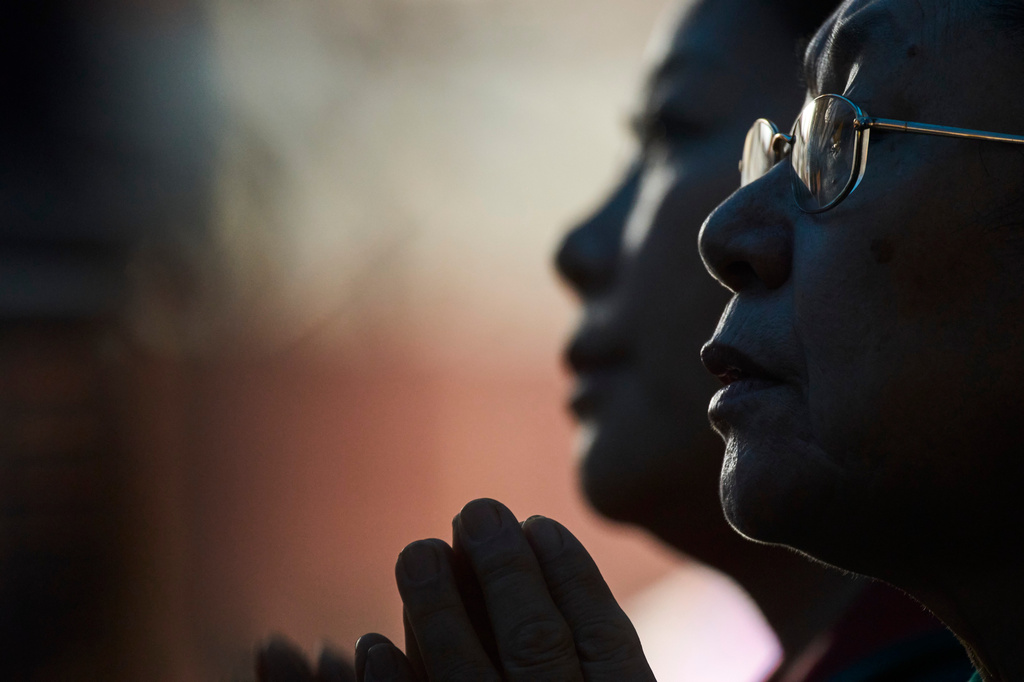 Tibetan women offer their prayers during the 91st birthday celebration of spiritual leader the Dalai Lama in Kathmandu, Nepal, Monday, July 6, 2026. (AP Photo/Niranjan Shrestha)