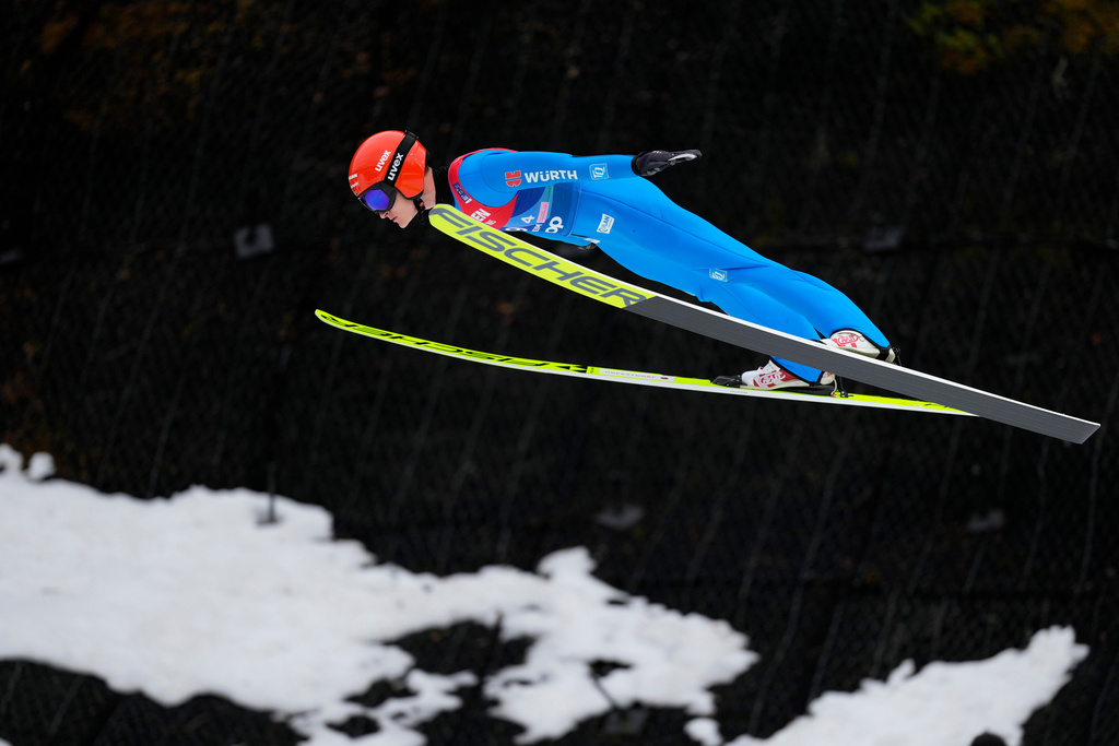 FILE - Julian Schmid, of Germany, soars through the air during the nordic combined men's team Gundersen LH/4X5 km competition at the Nordic World Ski Championships in Trondheim, Norway, March 7, 2025. (AP Photo/Matthias Schrader, File)
