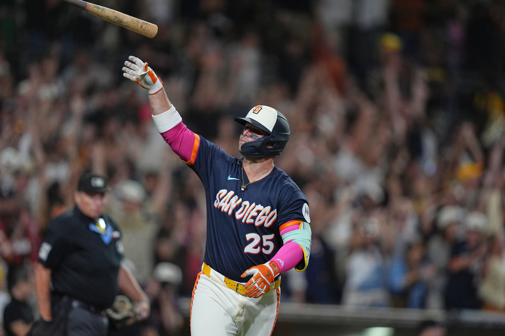 San Diego Padres' Ty France celebrates after hitting a three-run home run during the fifth inning of a baseball game against the Miami Marlins Friday, Sept. 18, 2026, in San Diego. (AP Photo/Gregory Bull)