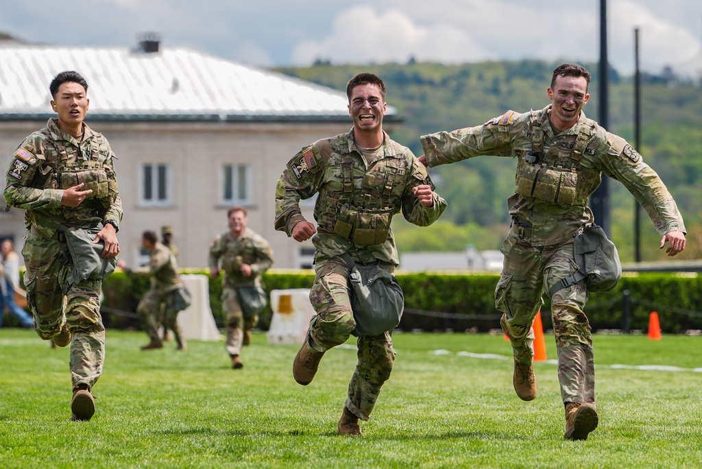 Texas A&M Army ROTC cadets run to the finish line of the crucible portion of the Sandhurst Military Skills Competition at the United States Military Academy in West Point, N.Y., Saturday, May 2, 2026. (AP Photo/Julia Demaree Nikhinson)