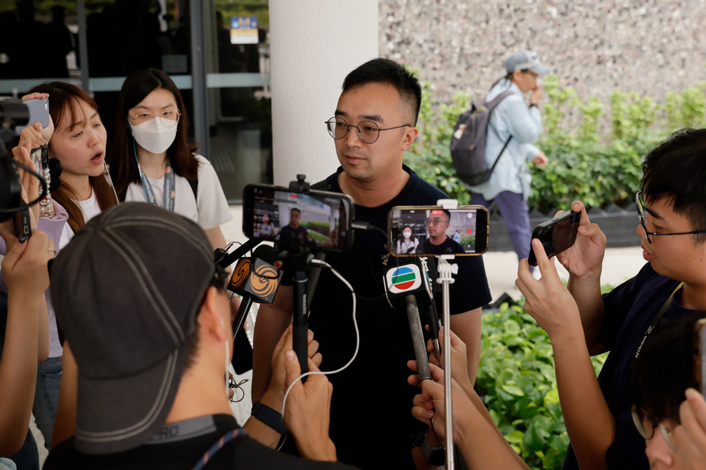 Patrick Liu speaks to the media following the closing submissions at the hearing of an independent committee investigating last year's Tai Po fire, in Hong Kong, Friday, July 17, 2026. (AP Photo/May James)