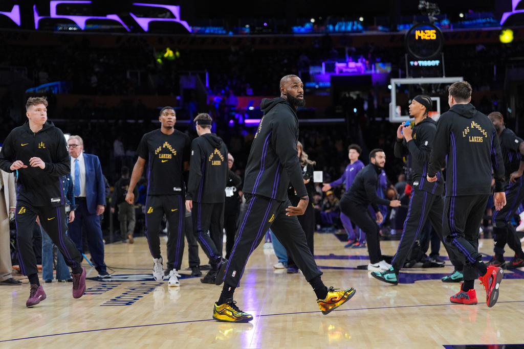 Los Angeles Lakers forward LeBron James warms up before the team's NBA basketball game against the Utah Jazz Tuesday, Nov. 18, 2025, in Los Angeles. (AP Photo/Jae C. Hong)