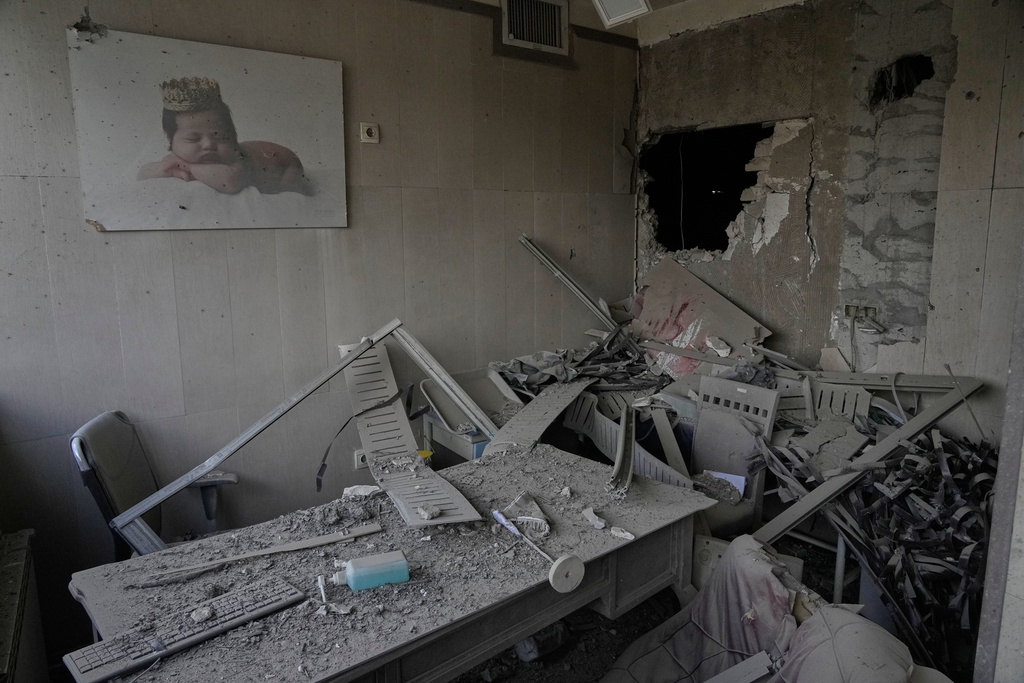 Debris is seen in a room of the Gandhi Hospital, which was damaged when a strike hit a state TV communications tower and nearby buildings across the street, during the ongoing joint U.S.-Israeli military campaign in Tehran, Iran, Monday, March 2, 2026. (AP Photo/Vahid Salemi)