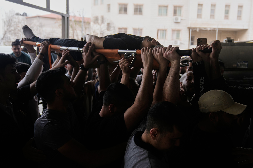 The body of Nayef Samaro, 26, who was killed in clashes with Israeli forces, is brought to Rafidia Hospital in the West Bank city of Nablus, Sunday, May 3, 2026. (AP Photo/Majdi Mohammed)
