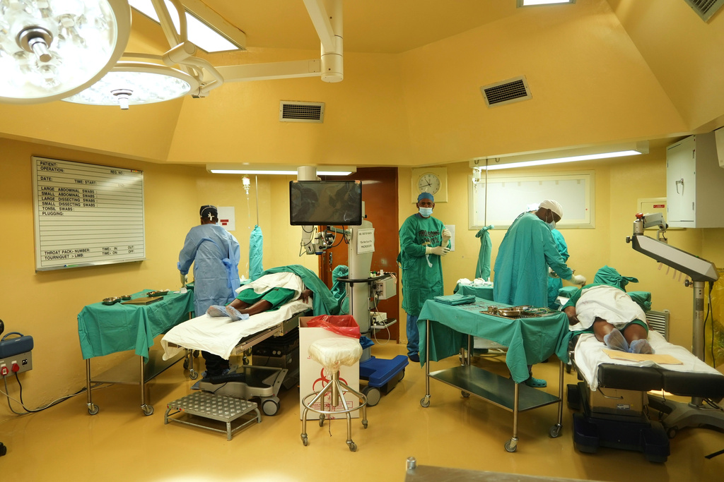 Ophthalmologists operate on two patients during a marathon cataract event, in Tsakane, South Africa, Saturday, March 28, 2026. (AP Photo/Kayleen Morgan)