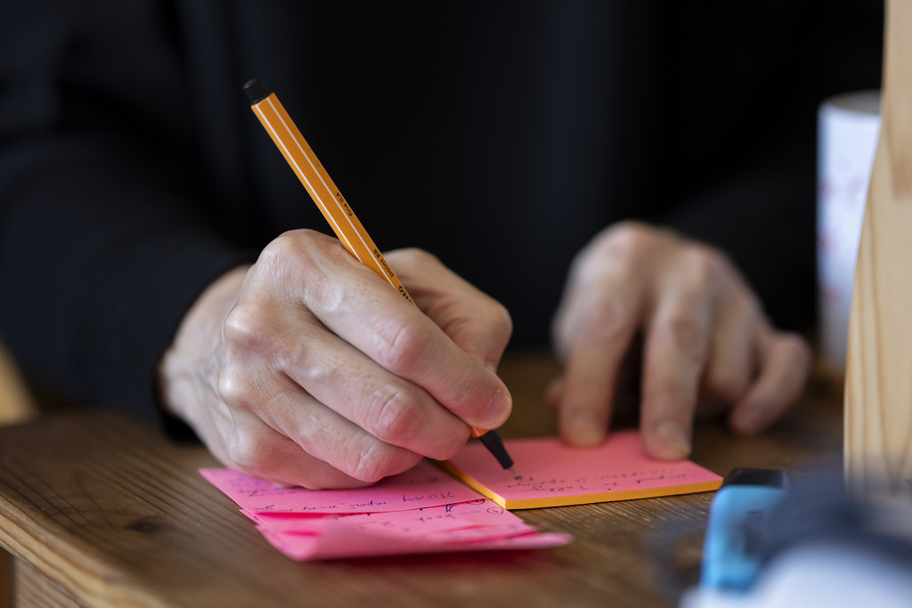 Sister Vassa Larin, a prominent American Orthodox nun, public speaker and YouTube presenter, takes notes before recording one of her videos in Vienna, Austria, on Wednesday, Sept 3. 2025. (AP Photo/Denes Erdos)