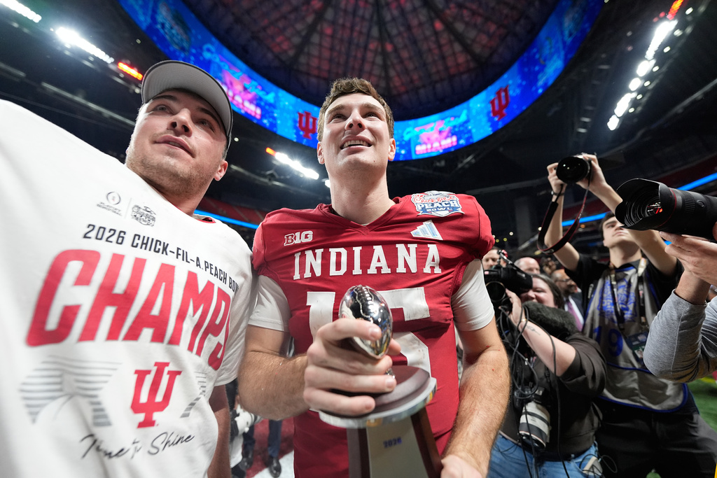 Indiana quarterback Fernando Mendoza (15) celebrates after the Peach Bowl NCAA college football playoff semifinal against Oregon, Friday, Jan. 9, 2026, in Atlanta. (AP Photo/Brynn Anderson)