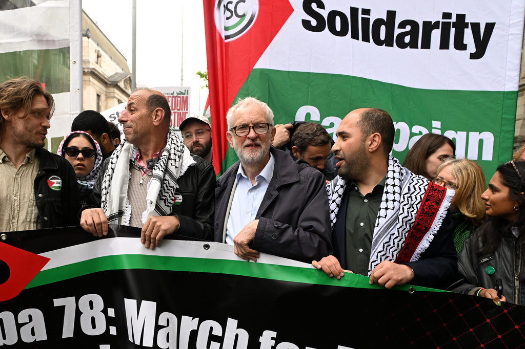 Member of Parliament Jeremy Corbin holds a banner during a Pro-Palestine march in London, Saturday, May 16, 2026.(AP Photo/Thomas Krych)