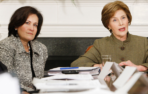 FILE - Anita McBride, left, Chief of Staff to first lady Laura Bush, right, looks on as Bush makes opening remarks during a video teleconference in the Roosevelt Room of the White House in Washington, Dec. 10, 2007. (AP Photo/Charles Dharapak, File) FILE - Anita McBride, left, Chief of Staff to first lady Laura Bush, right, looks on as Bush makes opening remarks during a video teleconference in the Roosevelt Room of the White House in Washington, Dec. 10, 2007. (AP Photo/Charles Dharapak, File)