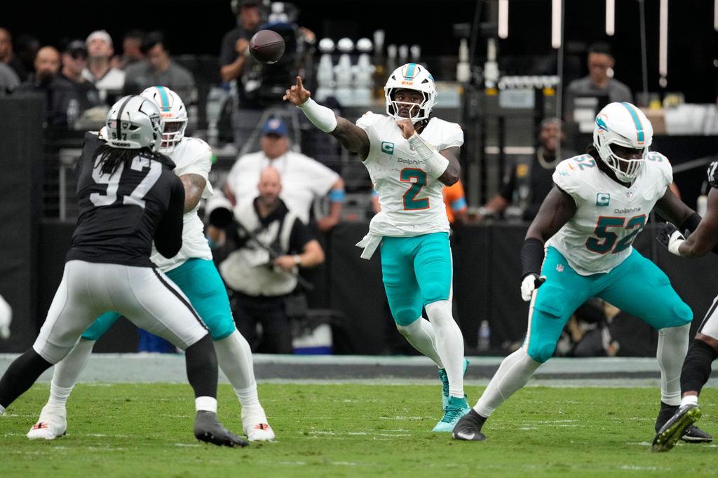 Miami Dolphins quarterback Malik Willis (2) throws a pass during the first half of an NFL football game against the Las Vegas Raiders, Sunday, Sept. 13, 2026, in Las Vegas. (AP Photo/Ross D. Franklin)