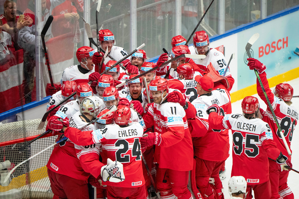 FILE - Denmark players celebrate after their 2-1 win in a quarterfinal game between Canada and Denmark at the hockey world championships, May 22, 2025, in Herning, Denmark. (Bo Amstrup/Ritzau Scanpix via AP, File)