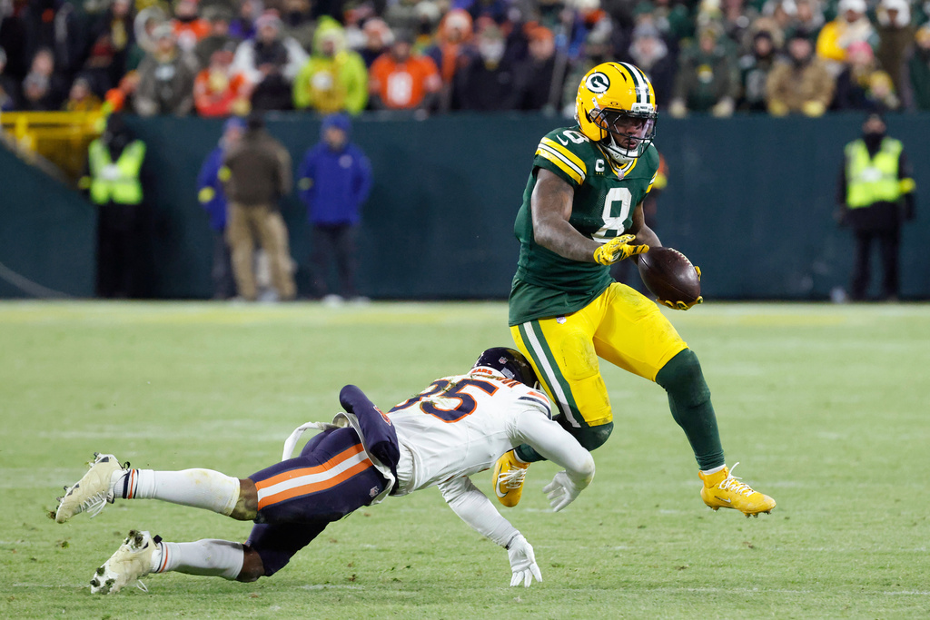 Green Bay Packers running back Josh Jacobs (8) runs against Chicago Bears safety C.J. Gardner-Johnson (35) during the second half of an NFL football game Sunday, Dec. 7, 2025, in Green Bay, Wis. (AP Photo/Mike Roemer)