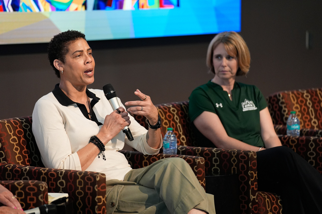 Former Basketball player Cheryl Miller speaks beside Julie Church, Delta State women's basketball assistant coach, during an event Thursday, April 2, 2026, in Phoenix. (AP Photo/John Locher)