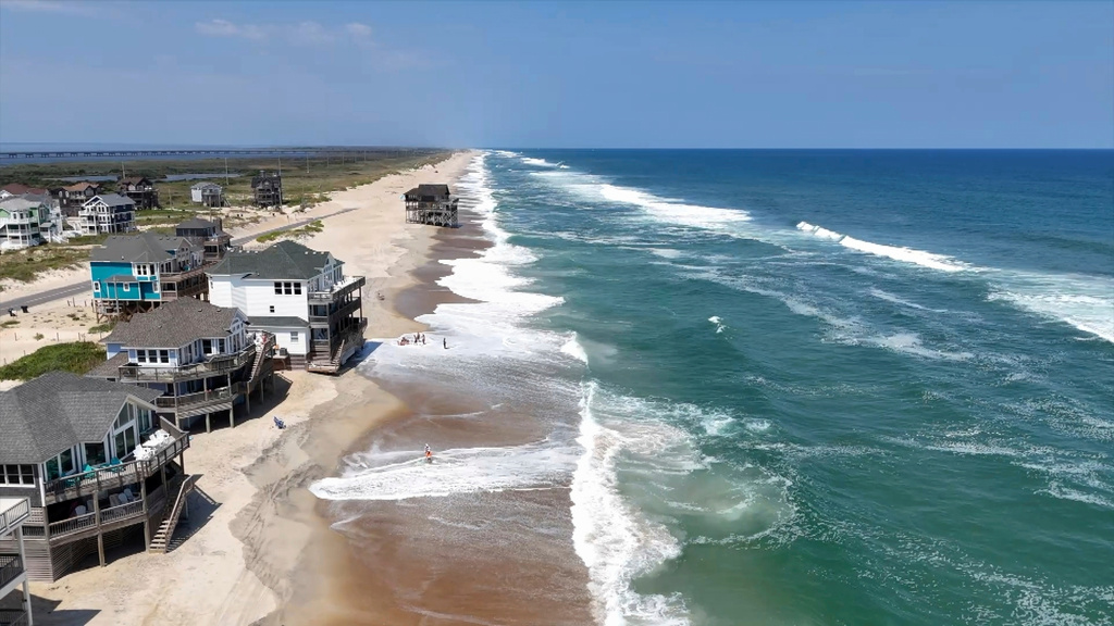 In this aerial image taken from video provided by WVEC-TV, homes along the Atlantic Coast in Dare County, N.C., are seen, Monday, Aug. 18, 2025, ahead of expected impacts from Hurricane Erin. (WVEC-TV via AP)