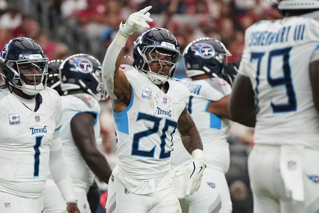 Tennessee Titans running back Tony Pollard (20) celebrates his touchdown during the second half of an NFL football game against the Arizona Cardinals, Sunday, Oct. 5, 2025, in Glendale, Ariz. (AP Photo/Rick Scuteri)