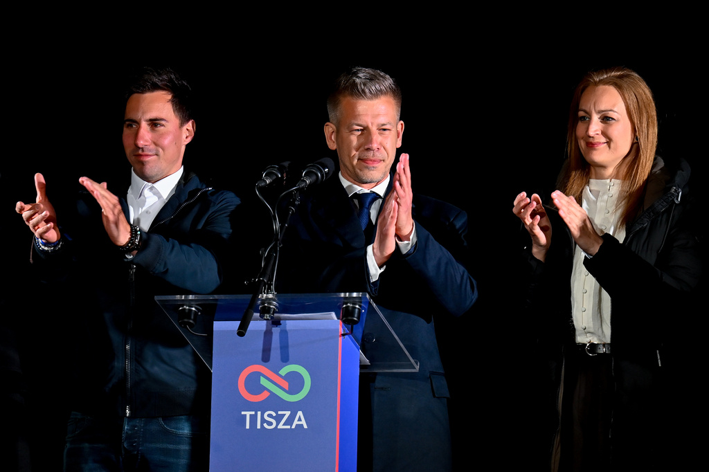 Peter Magyar, leader of the opposition Tisza party, center, speaks to his supporters following the announcement of the partial results of the parliamentary election, in Budapest, Hungary, Sunday, April 12, 2026. (AP Photo/Denes Erdos)