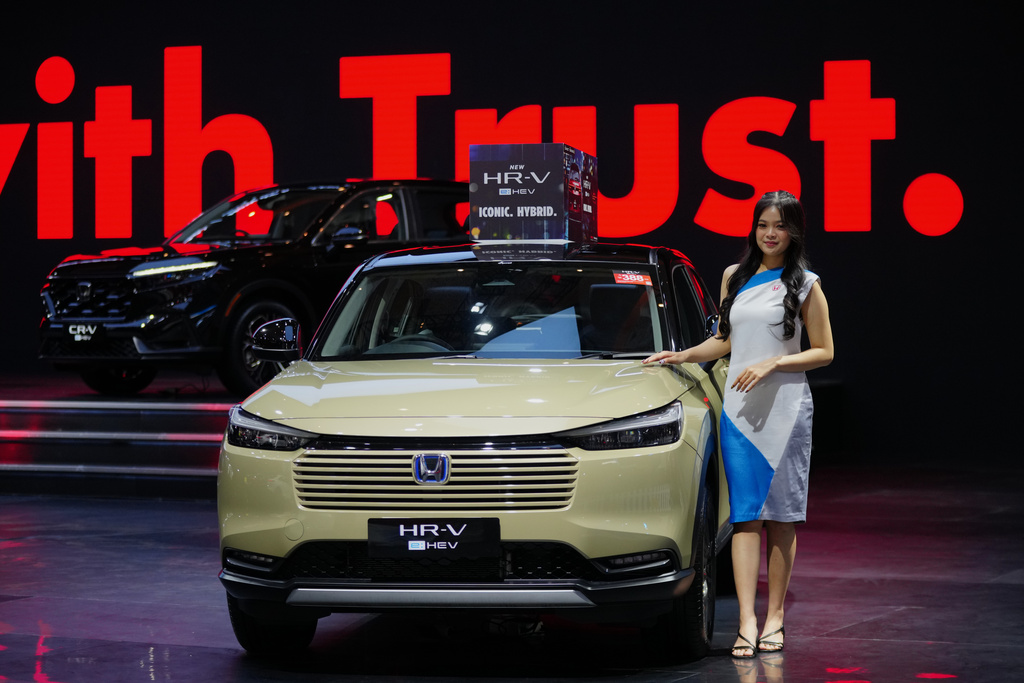 A model poses near a Honda HR-V car during the Indonesian International Motor Show in Jakarta, Indonesia, Thursday, Feb. 5, 2026. (AP Photo/Tatan Syuflana)