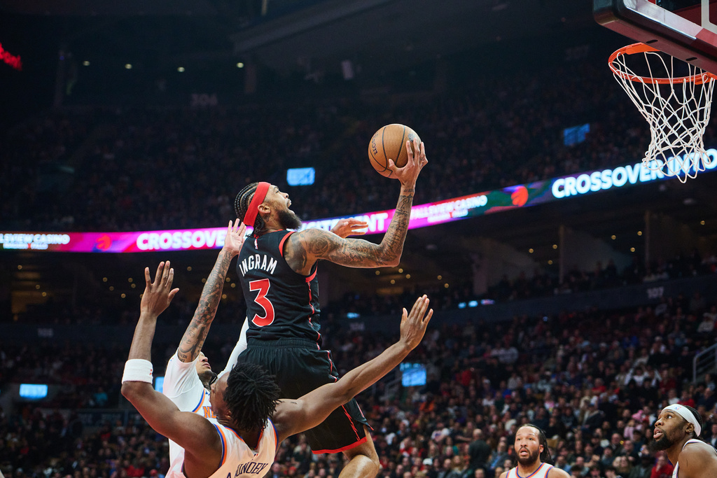 Toronto Raptors' Brandon Ingram (3) drives to the net during the first half of an NBA Cup basketball game against the New York Knicks in Toronto, Tuesday, Dec. 9, 2025. (Sammy Kogan/The Canadian Press via AP)
