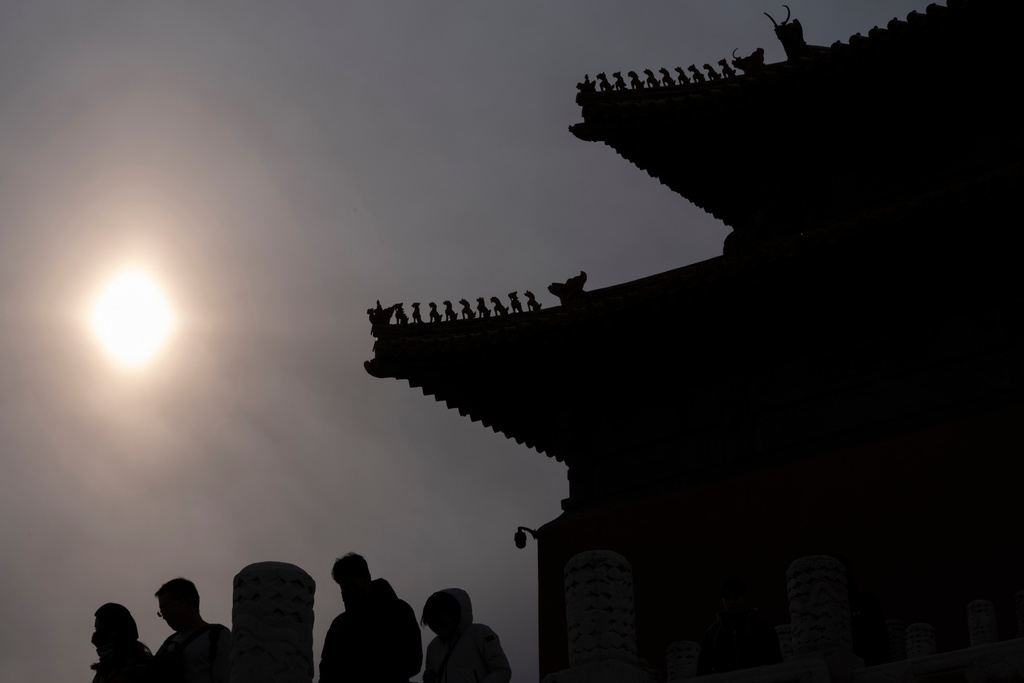 The silhouette of a security camera is seen near those of sacred ancient guardian beasts on the roofs of the more than 600-year-old Forbidden City in Beijing, Friday, Feb. 21, 2025. (AP Photo/Ng Han Guan)