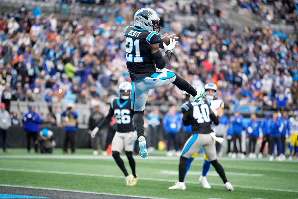 Carolina Panthers safety Nick Scott intercepts of pass against the Los Angeles Rams during the first half of an NFL football game, Sunday, Nov. 30, 2025, in Charlotte, N.C. (AP Photo/Jacob Kupferman)