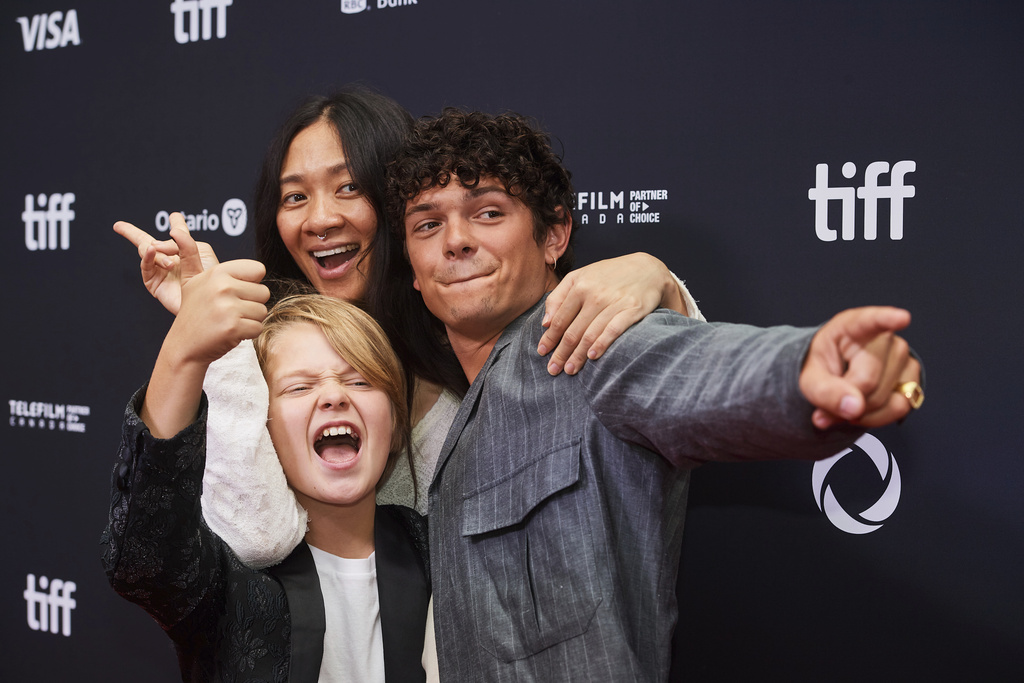 Actor Jacobi Jupe, left to right, director Chloé Zhao and actor Noah Jupe are photographed on the red carpet for the film "Hamnet" during the Toronto International Film Festival in Toronto, on Sunday, Sept. 7, 2025. (Sammy Kogan/The Canadian Press via AP)