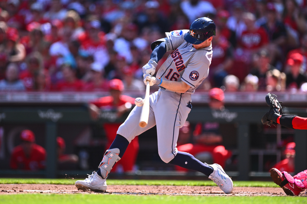 Houston Astros' Zach Cole hits a double during the second inning of a baseball game against the Cincinnati Reds in Cincinnati, Saturday, May 9, 2026. (AP Photo/Ben Jackson)