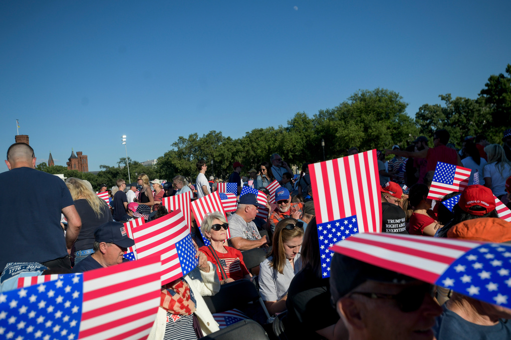 People arrive to hear President Donald Trump speak at the opening of the Great American State Fair on the National Mall, Wednesday, June 24, 2026, in Washington. (AP Photo/Rod Lamkey Jr.)