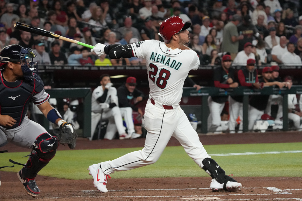 Arizona Diamondbacks' Nolan Arenado hits a single against the Atlanta Braves in the fourth inning of a baseball game, Thursday, April 2, 2026, in Phoenix. (AP Photo/Rick Scuteri)
