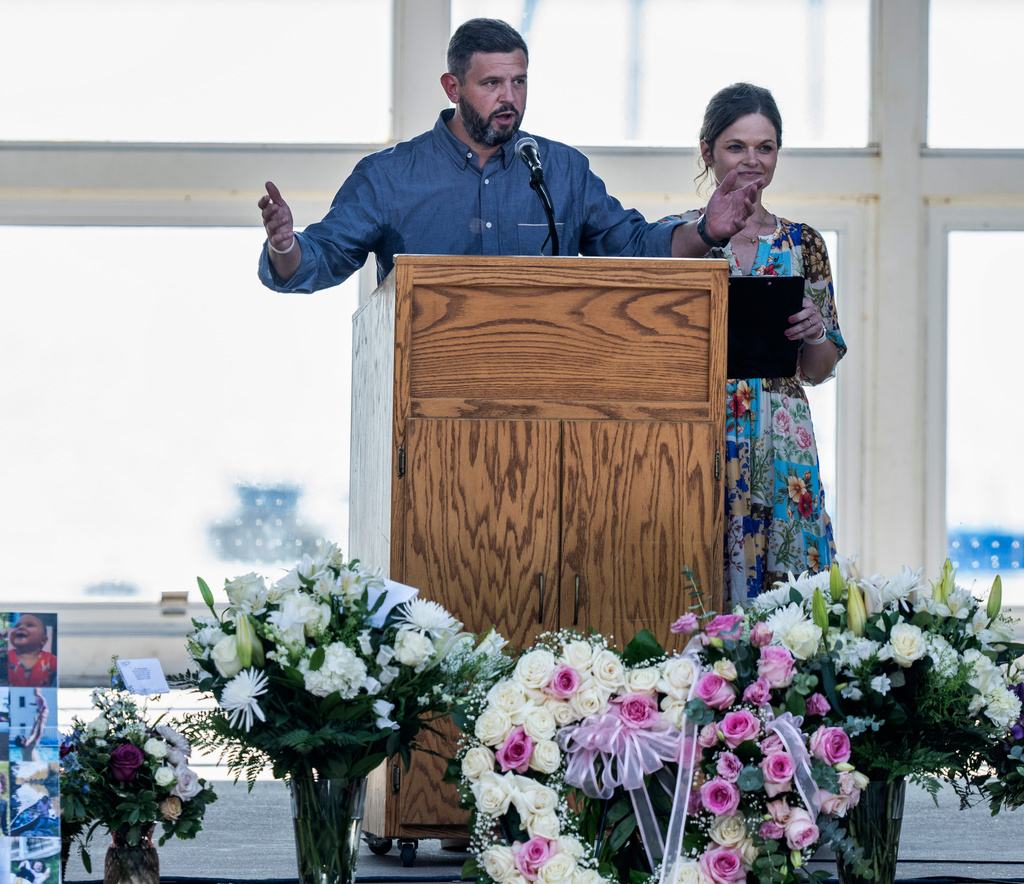 Parents Mike Moyski and Jackie Flavin thank the attendees who gathered for the celebration of life for Harper Moyski, who was killed in the Annunciation Catholic School church shooting, at the Lake Harriet Bandshell in Minneapolis, Minn., on Sunday, Sept. 14, 2025. (Richard Tsong-Taatarii/Star Tribune via AP)