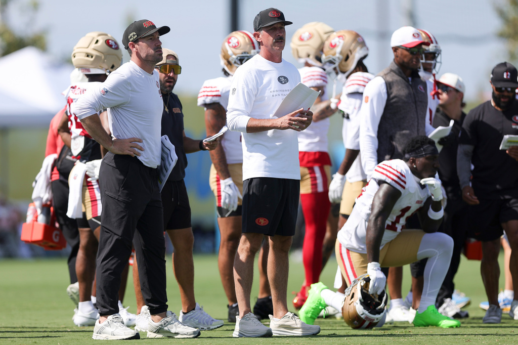 San Francisco 49ers head coach Kyle Shanahan watches during a joint NFL football practice with the Los Angeles Chargers, Tuesday, Aug. 18, 2026, in El Segundo, Calif. (AP Photo/Ryan Sun)