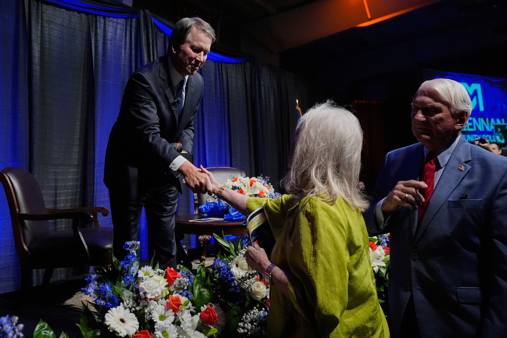 Justice Brett Kavanaugh, left, is greeted by attendees after he spoke at The Ken Starr Lecture at McLennan Community College, Thursday, Sept. 11, 2025, in Waco, Texas. (AP Photo/Tony Gutierrez)