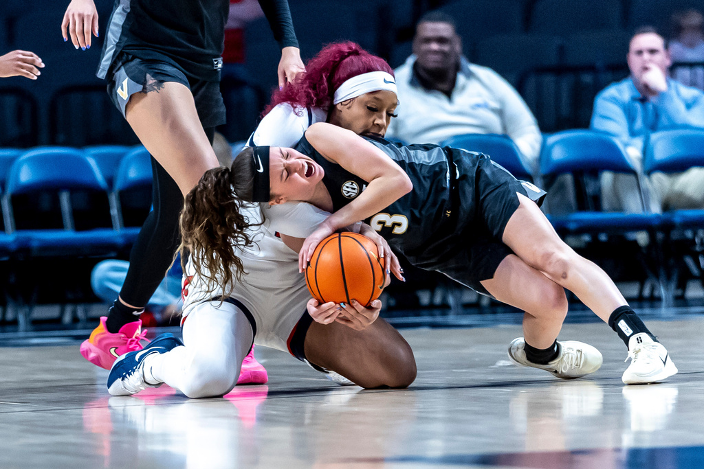 Vanderbilt guard Aubrey Galvan (3) and Mississippi forward Jayla Murray, top, battle for the ball during the first half of an NCAA college basketball game Friday, Jan. 30, 2026, in Birmingham, Ala. (AP Photo/Vasha Hunt)