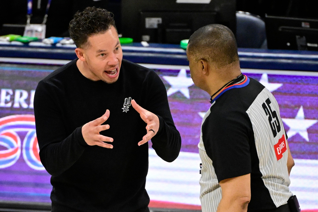 San Antonio Spurs head coach Mitch Johnson speaks to referee Tony Brothers in the second half of Game 5 in the Western Conference finals NBA basketball playoffs series against the Oklahoma City Thunder, Tuesday, May 26, 2026, in Oklahoma City. (AP Photo/Gerald Leong)