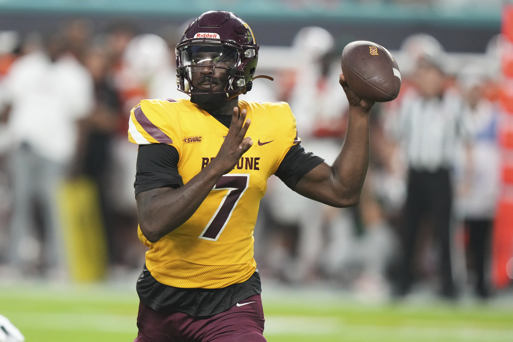 Bethune-Cookman quarterback Timmy McClain (7) stands back to pass during the first half of an NCAA college football game against Miami, Saturday, Sept. 6, 2025, in Miami Gardens, Fla. (AP Photo/Lynne Sladky)
