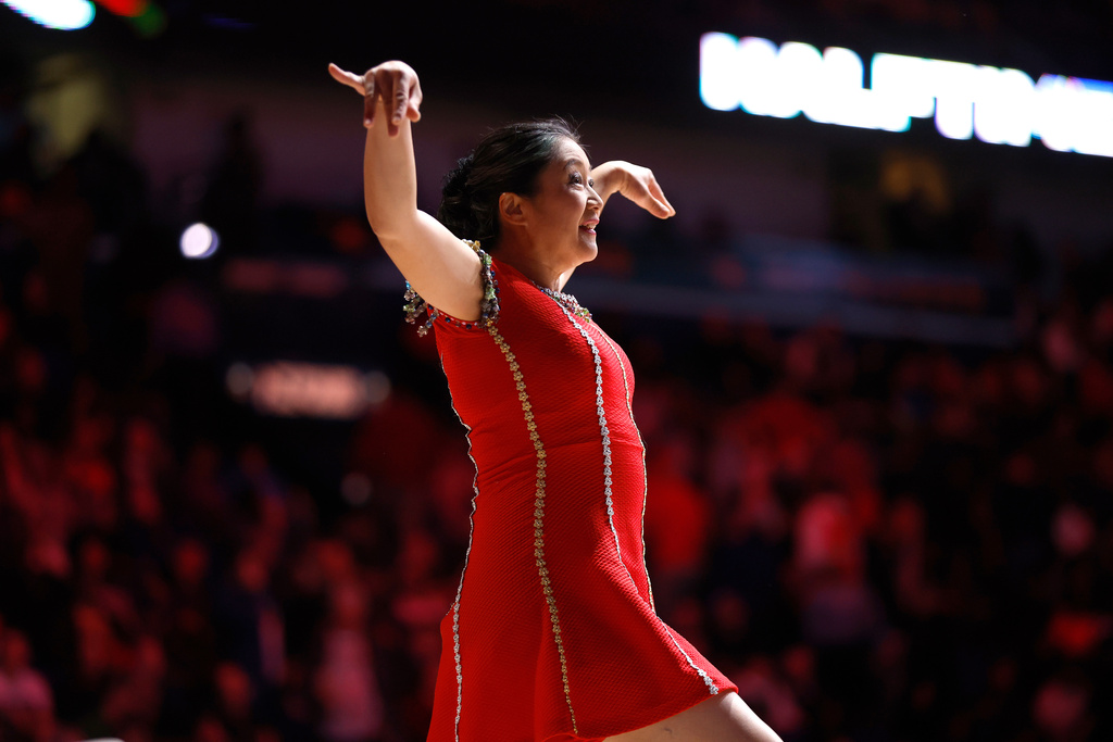 FILE - Rong Niu, also known as the performer Red Panda, performs at halftime during an NBA basketball game between the New Orleans Pelicans and the Los Angeles Clippers in New Orleans, Jan. 5, 2024. (AP Photo/Tyler Kaufman, File)
