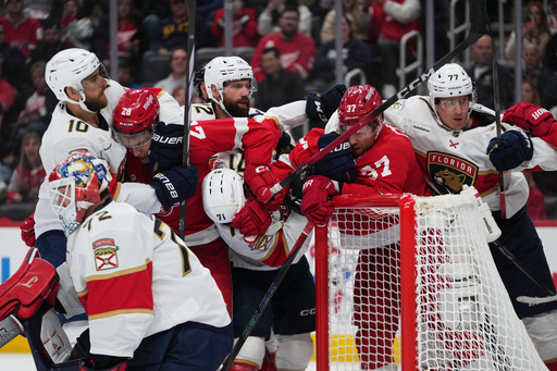 Detroit Red Wings and Florida Panthers players clutch and grab each other in the second period of an NHL hockey game Wednesday, Oct. 15, 2025, in Detroit. (AP Photo/Paul Sancya) Detroit Red Wings and Florida Panthers players clutch and grab each other in the second period of an NHL hockey game Wednesday, Oct. 15, 2025, in Detroit. (AP Photo/Paul Sancya)