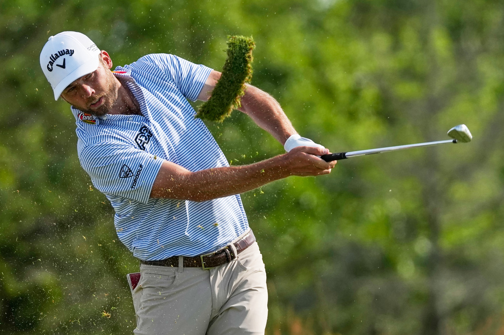 Sam Burns hits his tee shot on the 11th hole during the second round of the U.S. Open golf tournament at Shinnecock Hills Golf Club in Southampton, N.Y., Friday, June 19, 2026.(AP Photo/Seth Wenig)
