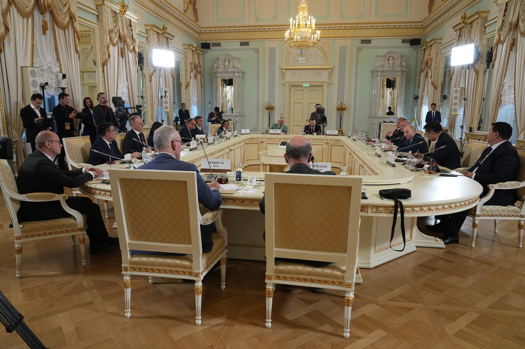 Russian President Vladimir Putin, background third right, meets with representatives of international news agencies on the sidelines of the St. Petersburg International Economic Forum at the Constantine Palace in St. Petersburg, Russia, on Thursday, June 4, 2026. (AP Photo/Dmitri Lovetsky, Pool)